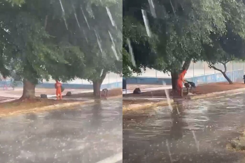 Trabalhador é filmado recolhendo lixo durante temporal, em Anápolis