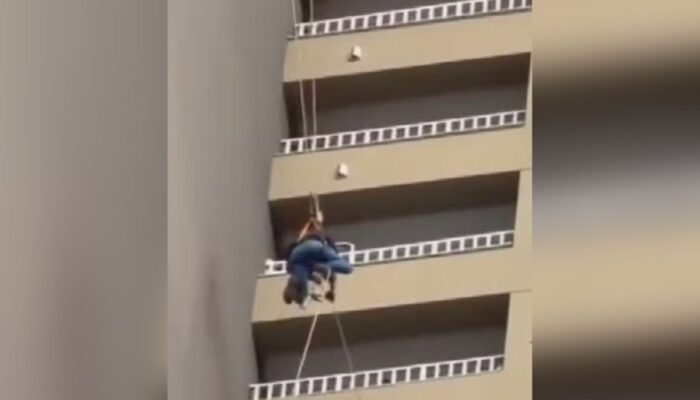 Trabalhador fica pendurado a 130 metros de altura em Goiânia; veja imagens