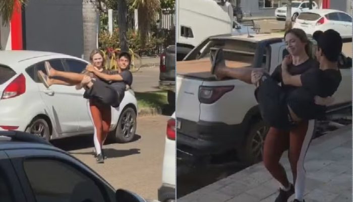 Casal viraliza após mulher carregar o marido no colo na saída de hospital, em Goiás